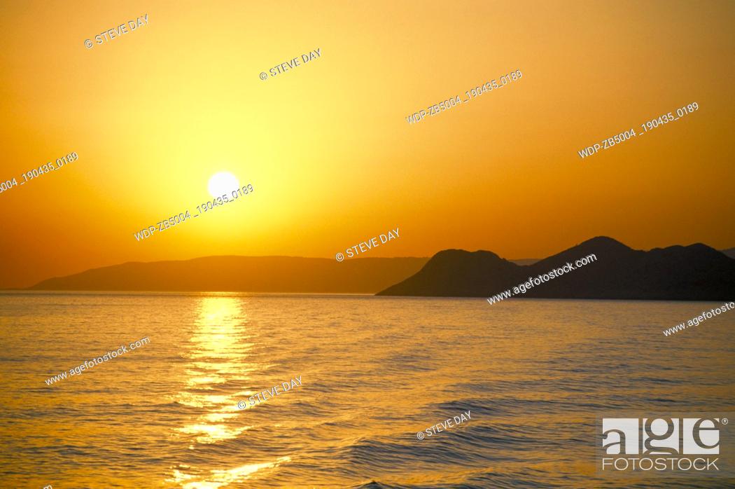 Stock Photo: View of island at sunset.